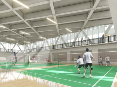 Indoor badminton court, with high ceilings and a catwalk.